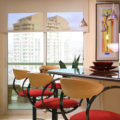 Kitchen solar shades with red barstools