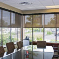 Insolroll commercial solar shades conference room