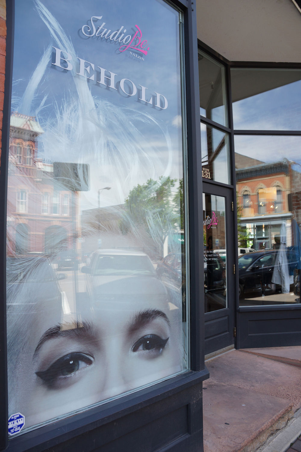 Insolroll printed shades shop window salon